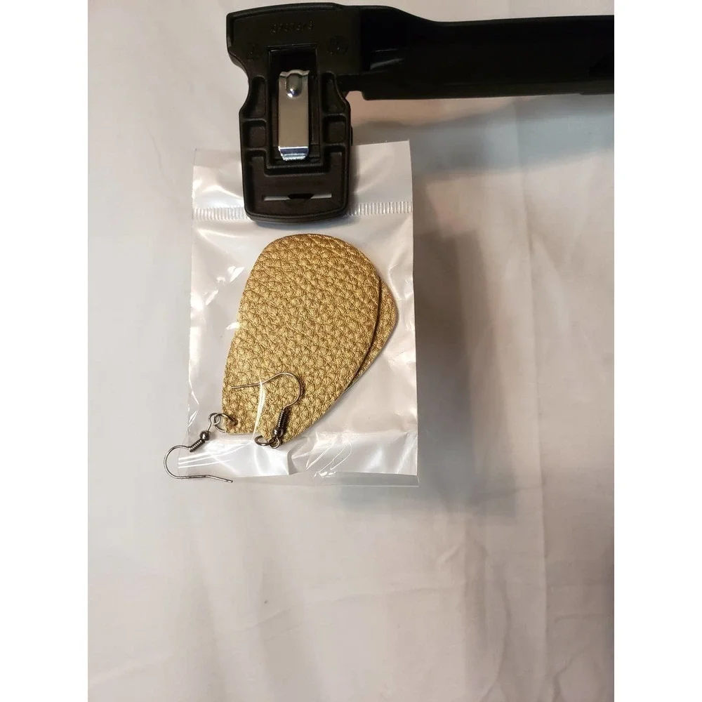 2 pair faux leather earrings. Gold and white. New in pkg.